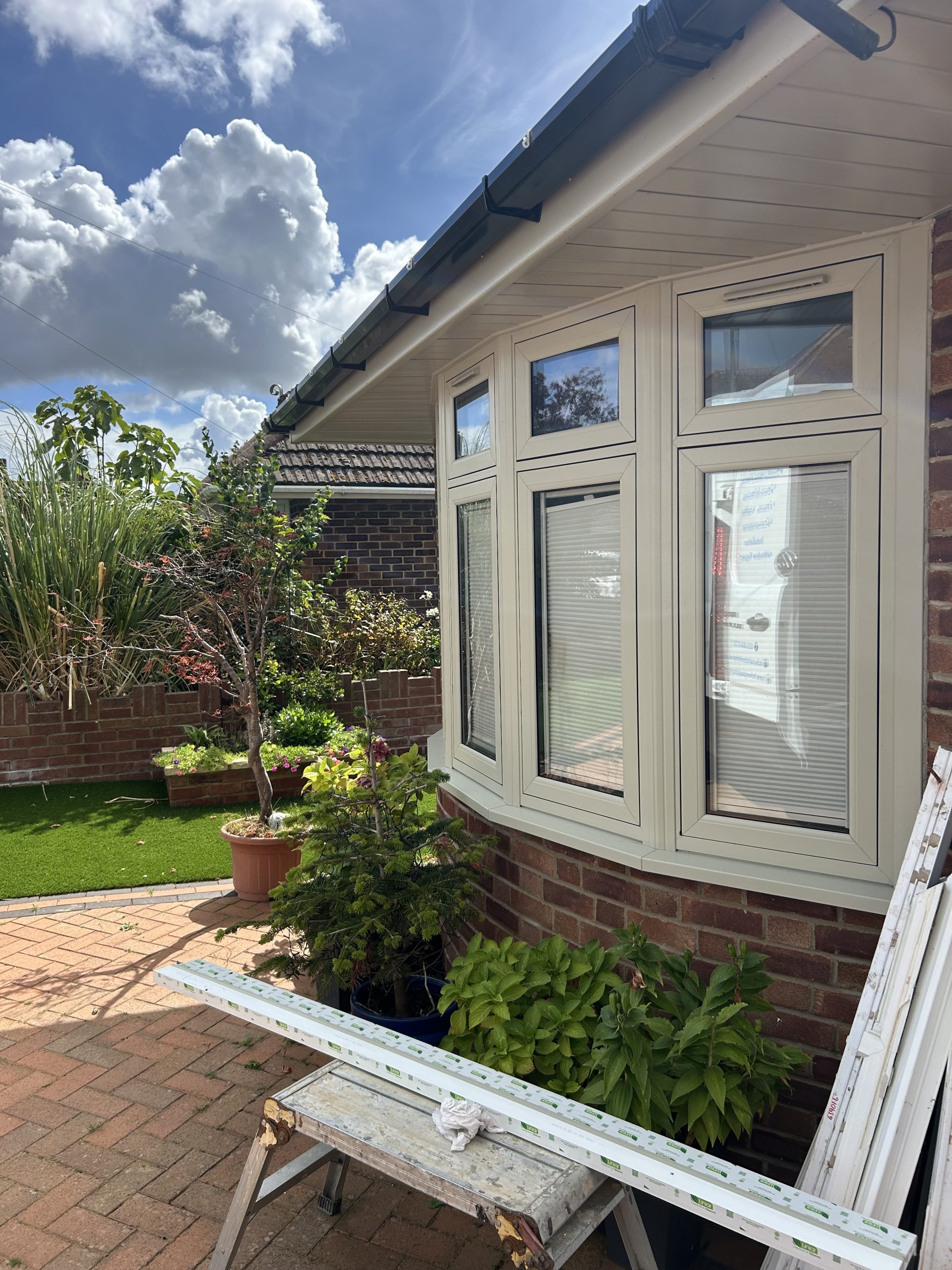 Cream uPVC bay window installation